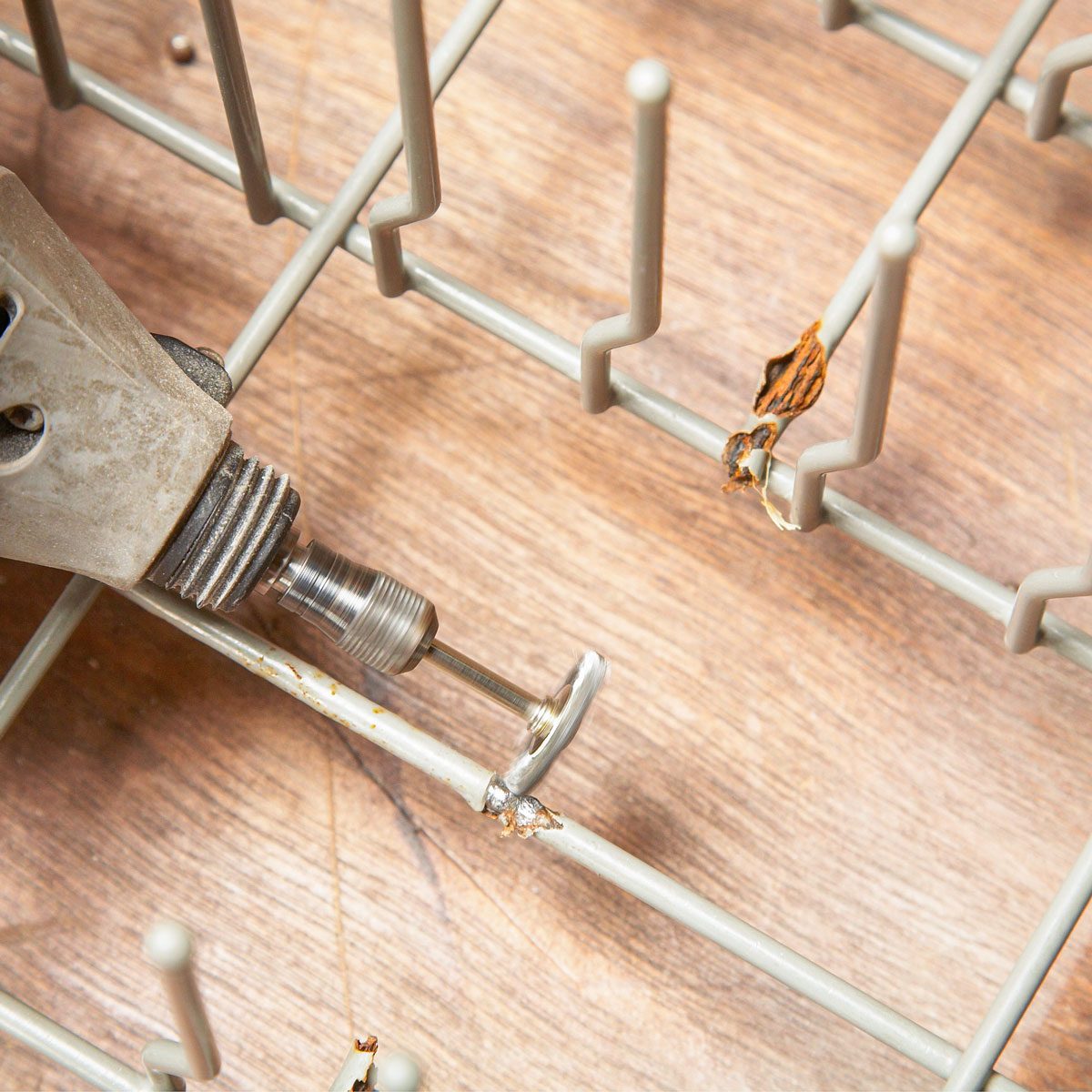 Cleaning Rust over Dishwasher Rack with Rotary Wire Brush