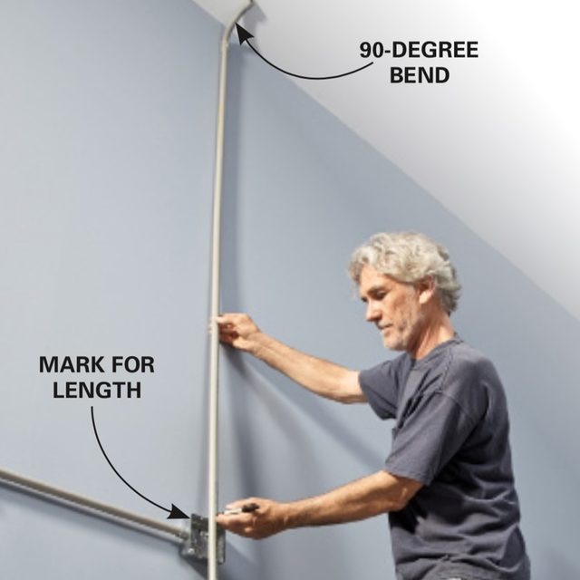 Marking vertical conduit on garage wall