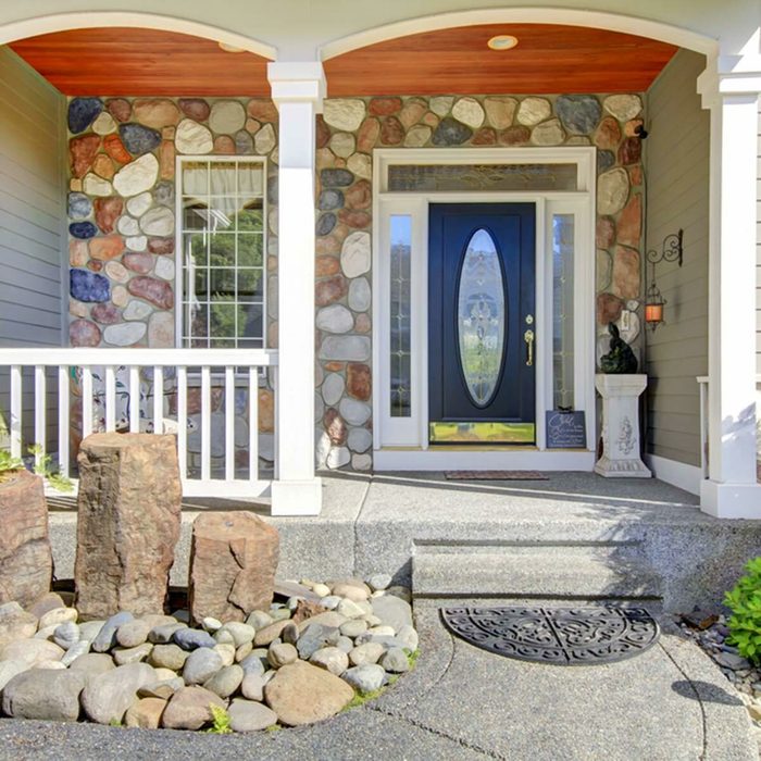 navy blue front door exterior front porch stone