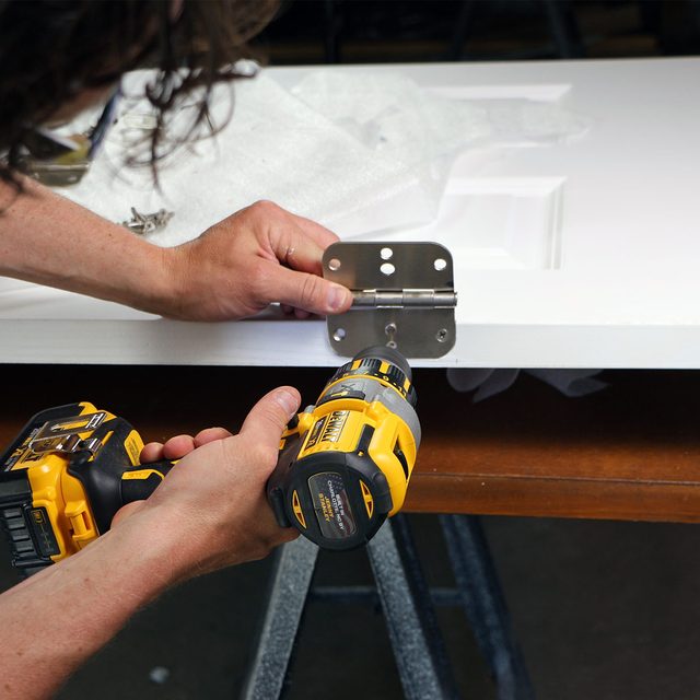 screw hinges to new door