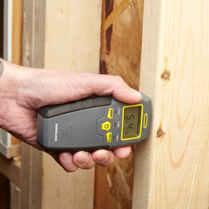 Poking wood with a moisture meter | Construction Pro Tips