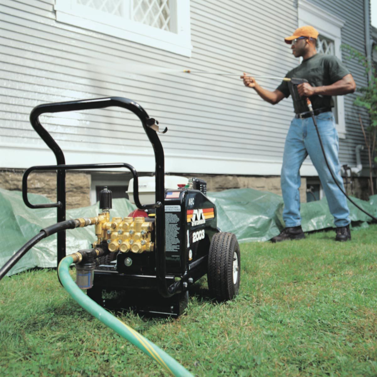 Pressure washing the outside of a house