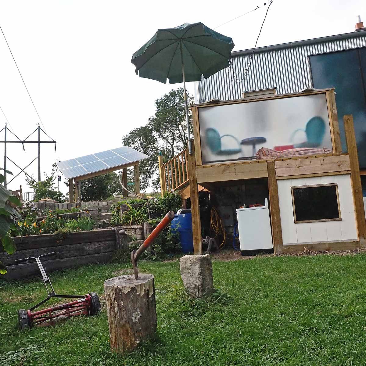 P9040700(adjusted) unique tiny house backyard cat patio deck solar panels vegetable garden