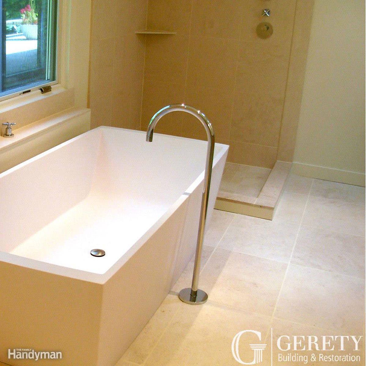 A modern bathtub stands in a well-lit bathroom, with a sleek faucet and minimalistic design, surrounded by light-colored tiles and a glass window.
