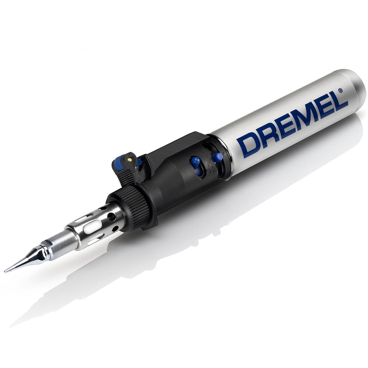 A silver Dremel tool with a pointed tip is positioned diagonally, showcasing its adjustable features against a plain, reflective background.
