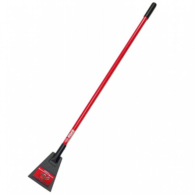 A red-handled scraper tool stands upright, its triangular metal blade poised for scraping surfaces, likely in a garage or outdoor setting.
