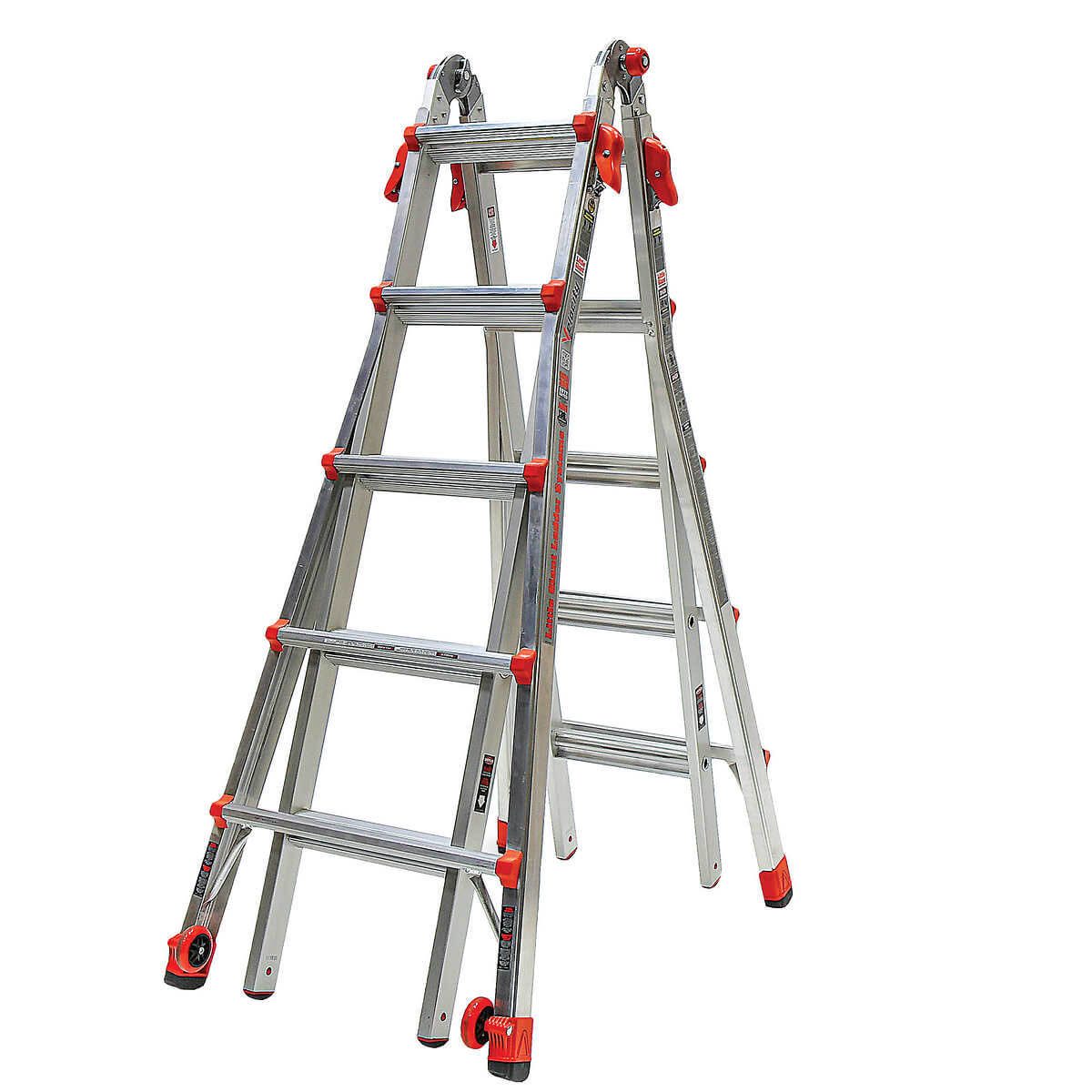 A multi-step aluminum ladder stands upright, featuring red locking mechanisms and side rails, designed for accessing high places.