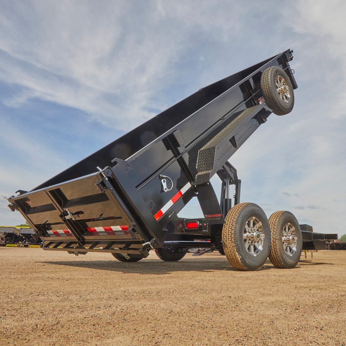 Black Dump Trailer in Dump Position | Construction Pro Tips