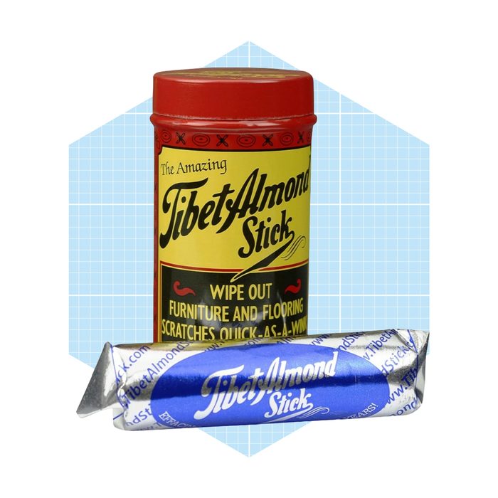 A red canister and a blue tube labeled 