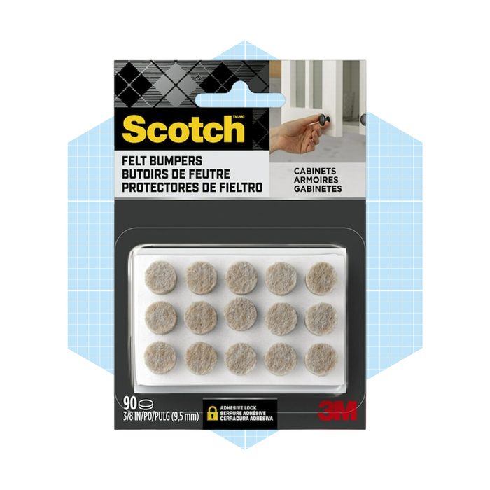 Felt bumpers are arranged on a backing, ready for application. They protect surfaces from scratches and are packaged with branding and usage instructions.