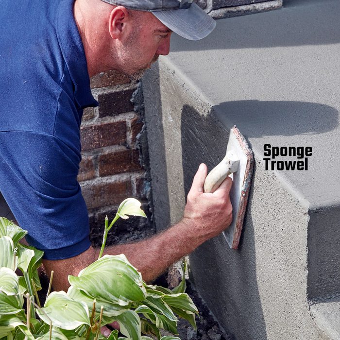 Troweling the bare sides of the step | Construction Pro Tips