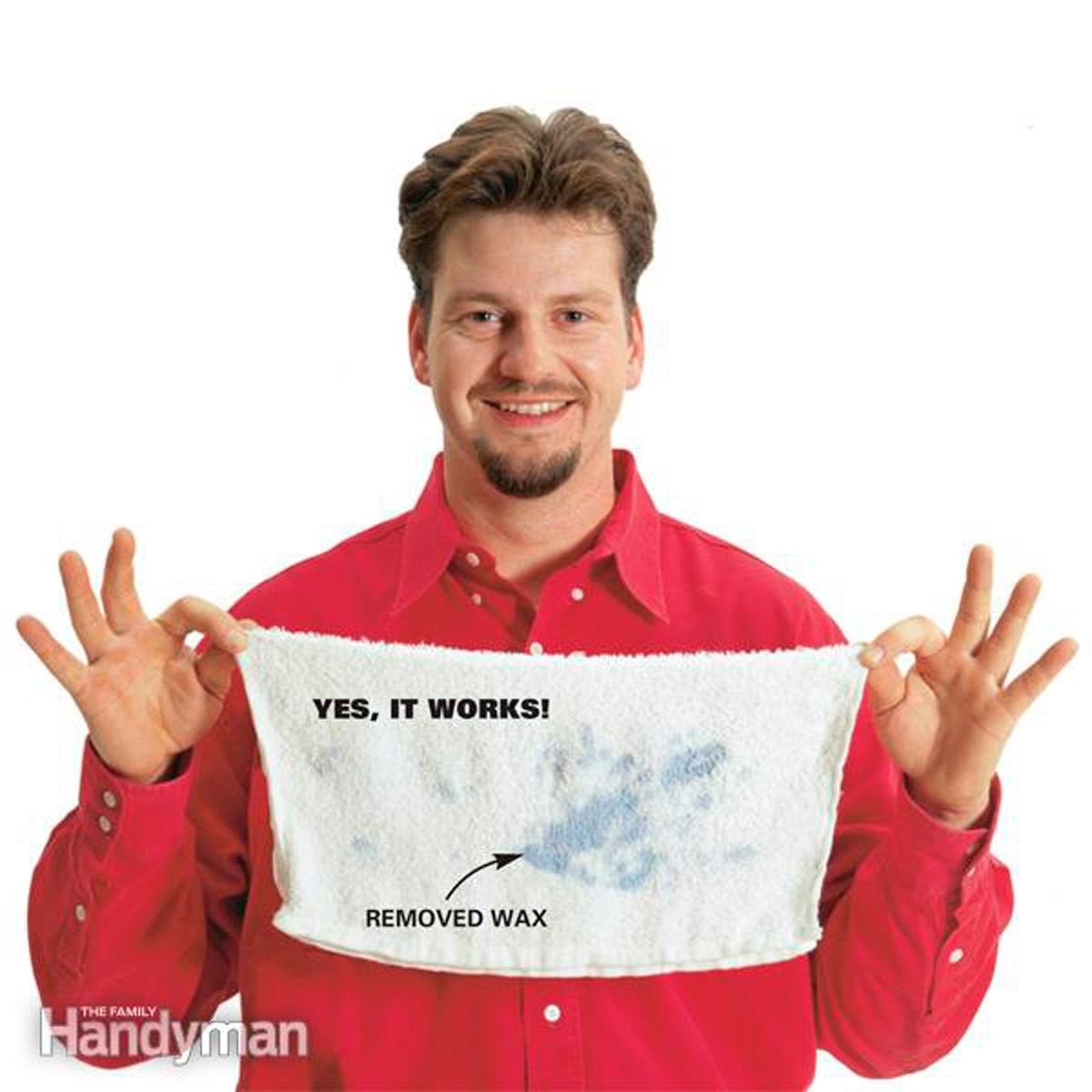 A man in a red shirt holds up a white towel, displaying a stain and text proclaiming its effectiveness in removing wax.