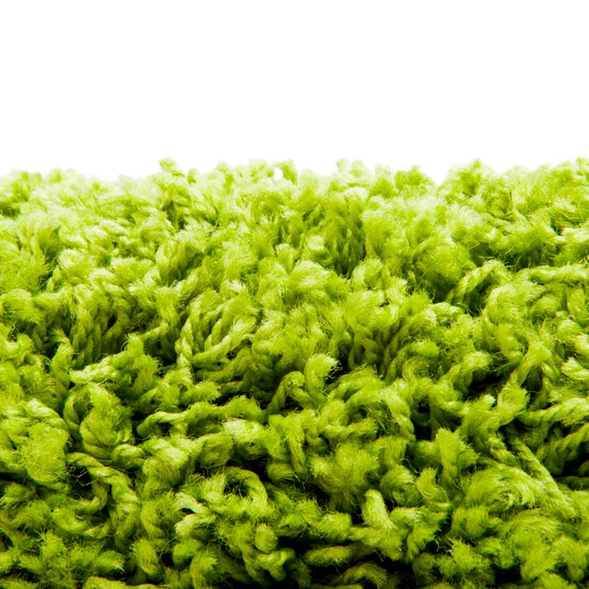A vibrant green textured surface resembles shag carpet, with soft, tangled fibers peeking through, creating a lively and inviting appearance against a white background.