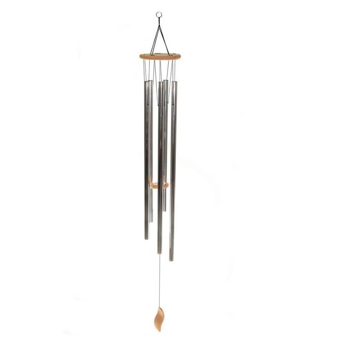 A wind chime hangs vertically with metal tubes creating sound as they sway gently in a light breeze against a white background.