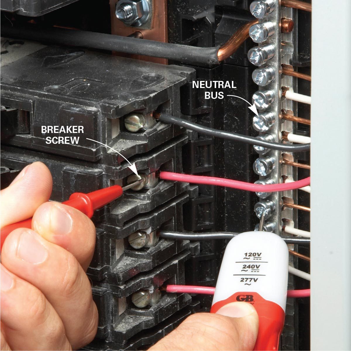 A hand is using a multimeter probe to test a breaker screw inside an electrical panel, surrounded by wires and a neutral bus connection.
