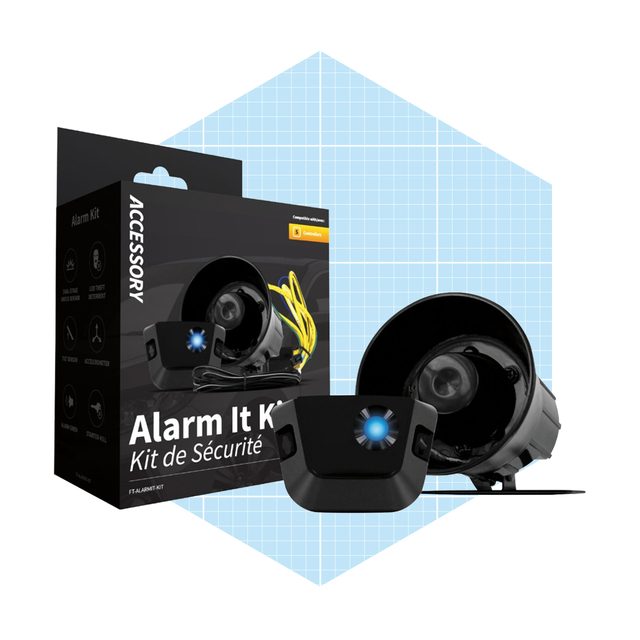 A security alarm kit is displayed, featuring a speaker and sensor, positioned next to its packaging on a light blue geometric background.