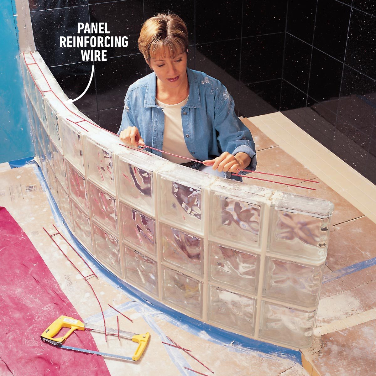 mixing mortar and adding reinforcing to install a glass block shower