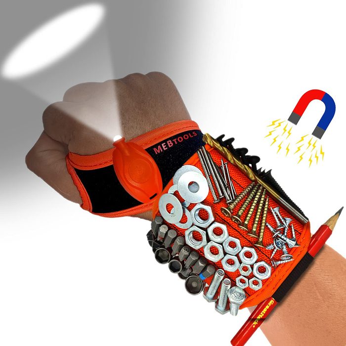 A wristband equipped with tools and hardware showcases a flashlight on the top and a magnet symbol, set against a neutral background.