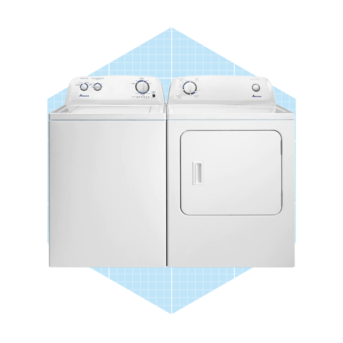 A stacked washing machine and dryer set, both in white, positioned against a light blue grid-patterned background. Controls and dials are visible on top.