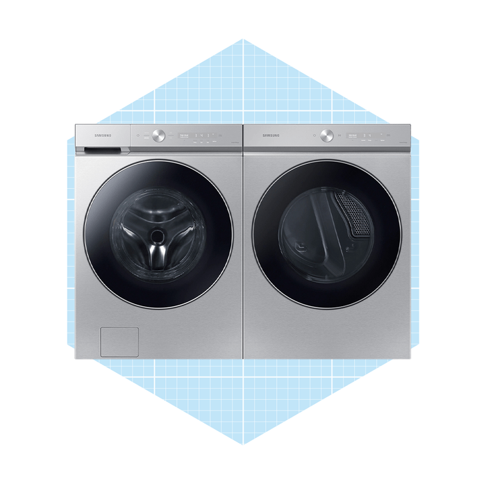 A stainless steel washer-dryer combo sits side by side, featuring transparent doors. They
