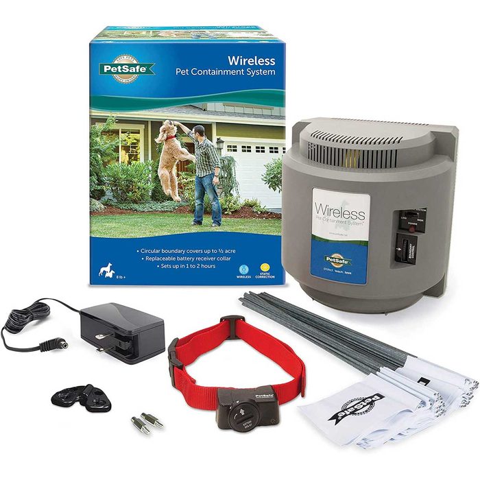 A pet containment system is displayed, featuring a wireless unit, collar, charger, flags, and instructions, set against a home and garden background.