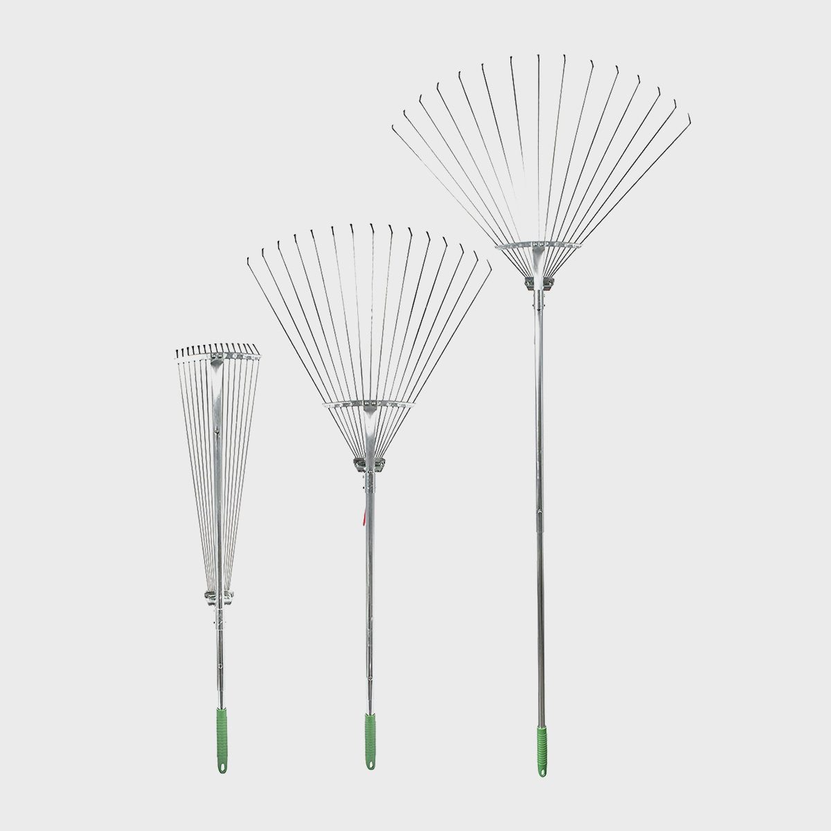 Three metallic rakes with long handles are displayed, arranged from shortest to tallest, featuring flexible, widely spaced tines and green rubber grips.
