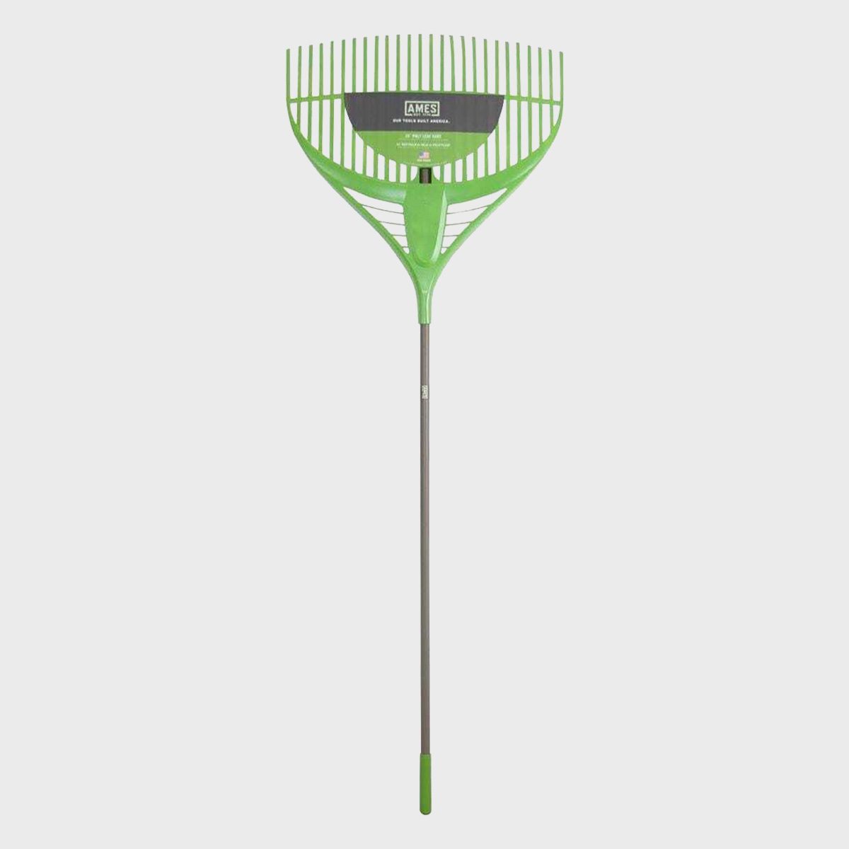A green rake stands upright, designed to gather leaves or debris, set against a plain white background for clarity.