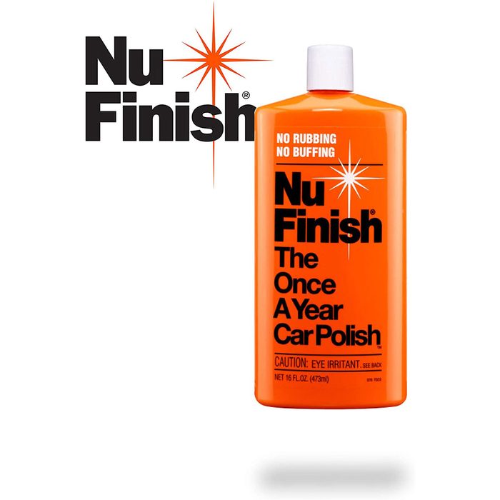 A bright orange bottle of car polish is displayed prominently, stating it