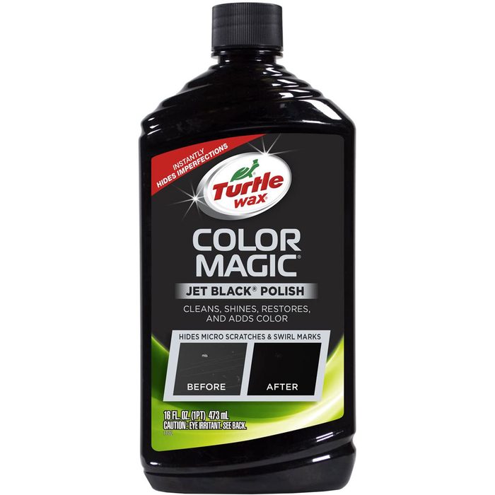 A black bottle of Turtle Wax Color Magic polish stands vertical, labeled with cleaning benefits, featuring before and after imagery to showcase its effects.