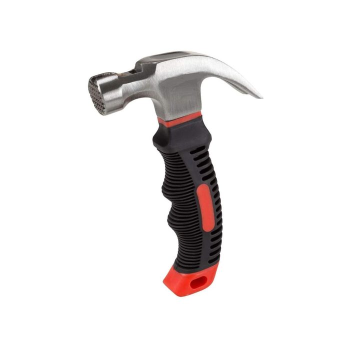 A claw hammer with a textured black and red handle is positioned upright, showcasing its sturdy metal head and pronged claw for pulling nails.