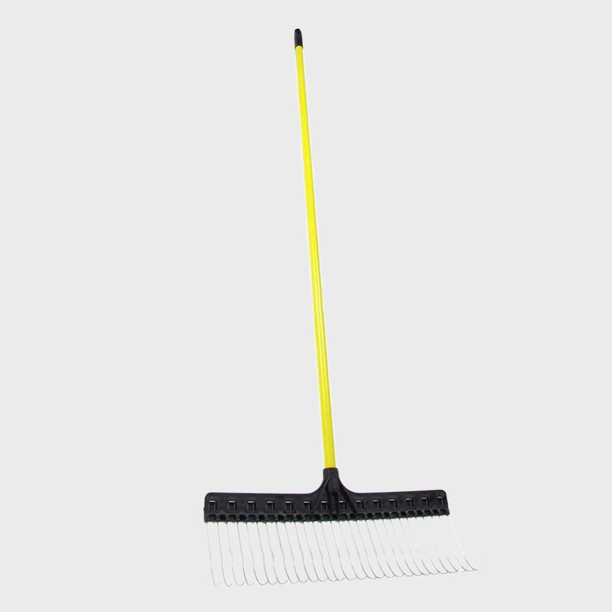 A garden rake with a yellow handle and black head stands upright, designed for gathering leaves or debris in a gardening context.