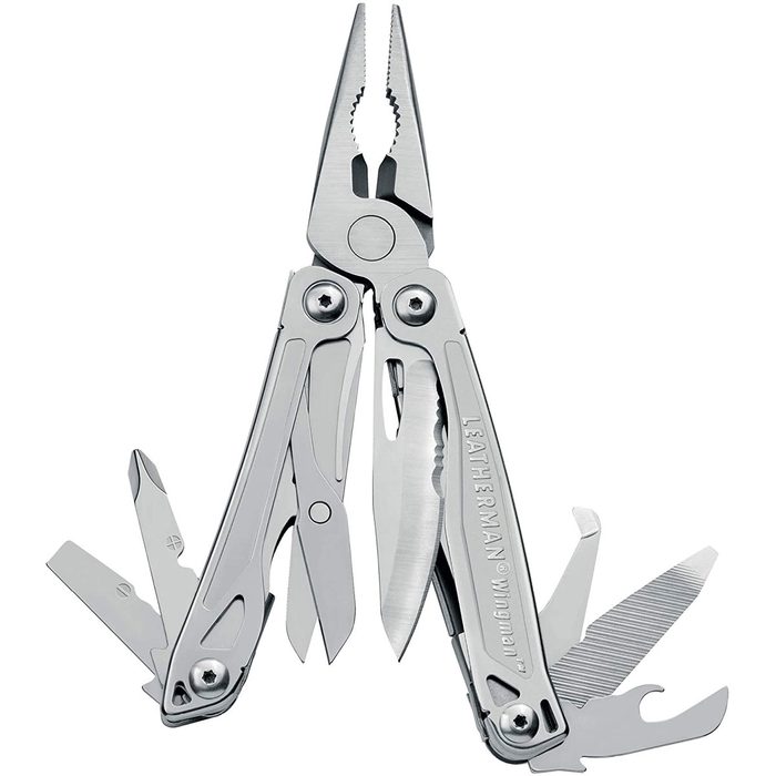 A multi-tool expands its pliers and various blades, designed for versatility, showcasing stainless steel in a neutral background.