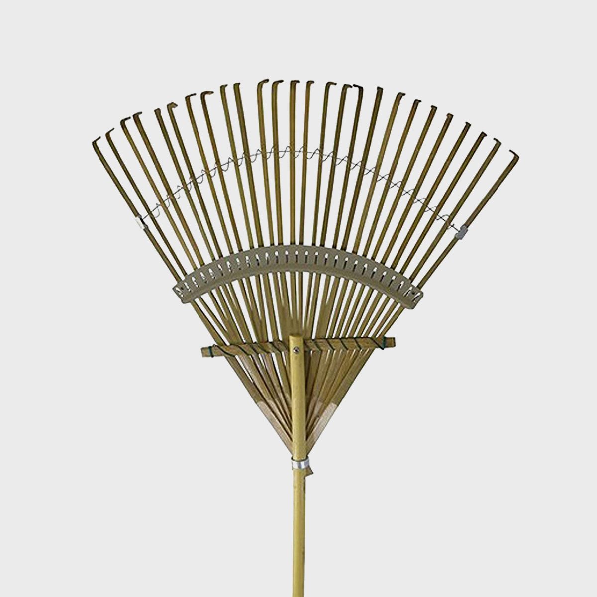 A wide, fan-shaped rake with multiple tines is positioned upright, designed for gathering leaves and yard debris. Its wooden handle extends downward.