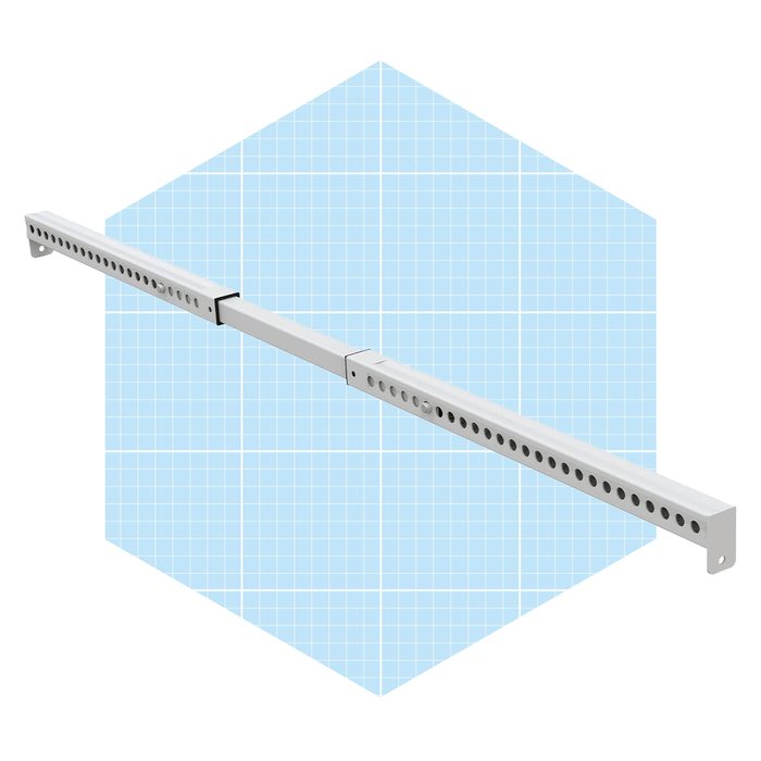 A long, white metal rail with holes runs horizontally, connecting in the middle, set against a light blue grid background, suggesting a technical or design context.