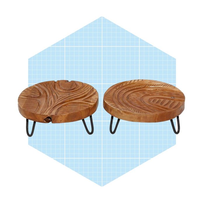 Two wooden round tables with textured surfaces, supported by metal legs, displayed against a light blue grid background.