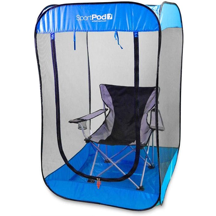 A portable, mesh shelter with an internal folding chair positioned inside, providing shaded seating likely for outdoor use.