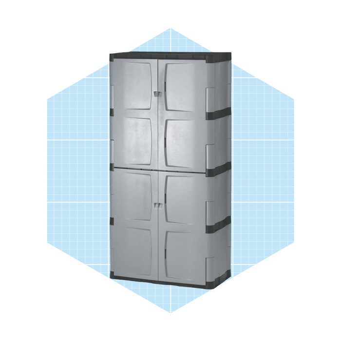 A tall, gray storage cabinet stands upright, featuring four doors for access, against a light blue grid-patterned background.