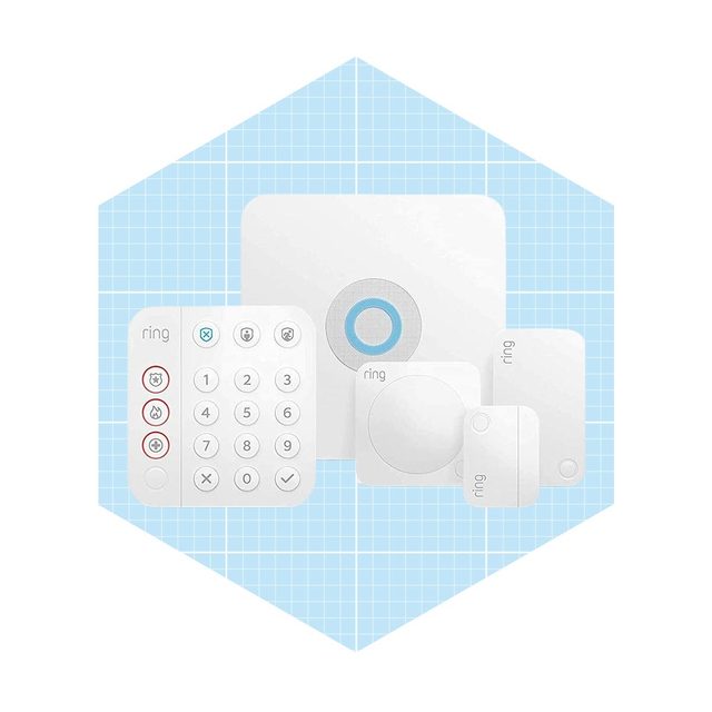 A collection of white security devices, including a keypad, sensor, and hub, is arranged on a light blue grid background, indicating a smart home system.