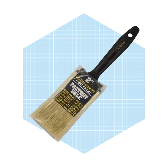 A 2-inch paint brush is displayed, its bristles are packaged, indicating it