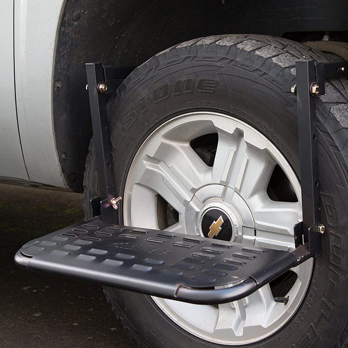 A sturdy step is attached to a vehicle