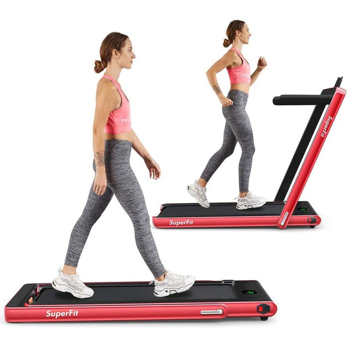 A woman walks and jogs on a red treadmill labeled 