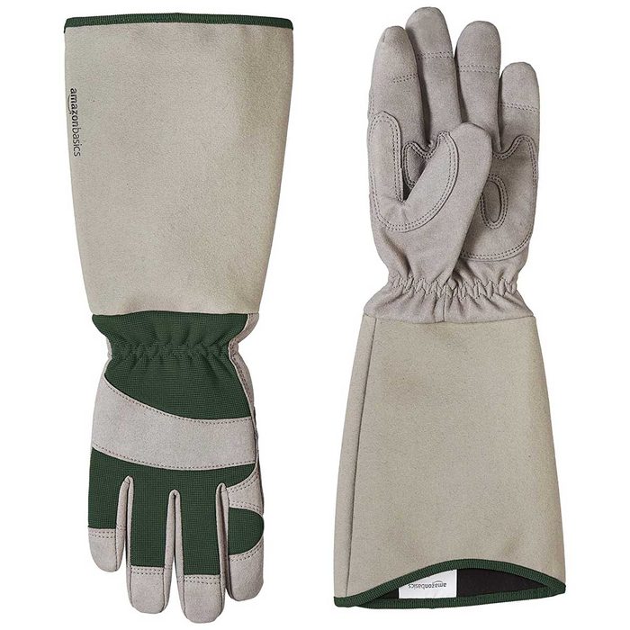 A pair of work gloves lies flat, designed for durability with green accents, suitable for protective tasks in gardening or manual labor.