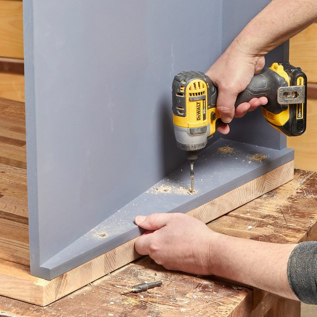 Fasten the cabinet to the work surface