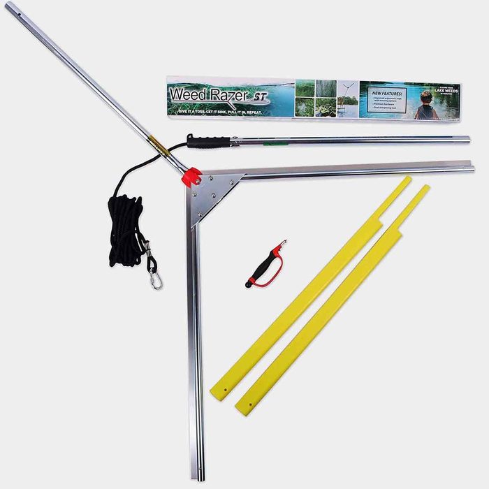 A weed removal tool is positioned with a cutting blade, rope, and two yellow handles, displayed against a blank background, suggesting gardening use.