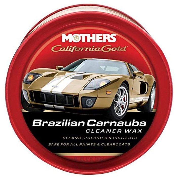 A round can of cleaner wax features a gold sports car on its label, promoting polish and protection for all paint types in a red container.