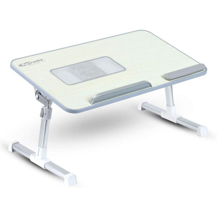 A portable, adjustable laptop table is positioned with supports. It features a light wood surface and ventilation mesh, suitable for use in various environments.