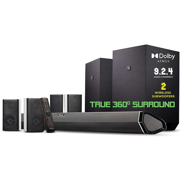 A sound system with a soundbar, two wireless subwoofers, and multiple speakers is displayed, emphasizing true 360° surround sound capabilities in a home environment.