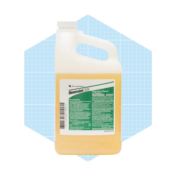 A plastic jug of herbicide with a handle displays safety warnings and usage instructions, set against a light blue geometric background.