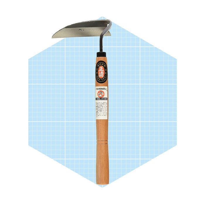 A hand-held gardening tool with a curved blade is positioned against a light blue geometric background, intended for weeding and soil cultivation.