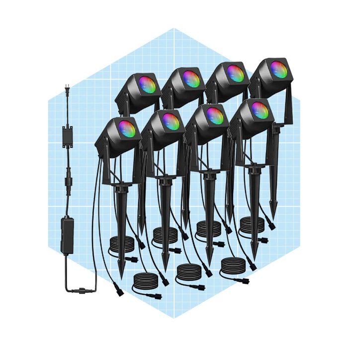 Eight colorful outdoor lights are arranged in a hexagonal formation, connected to power sources and wires, set against a light blue grid background.